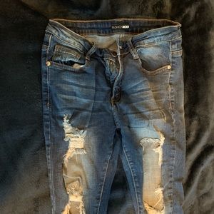 Dark denim distressed jean